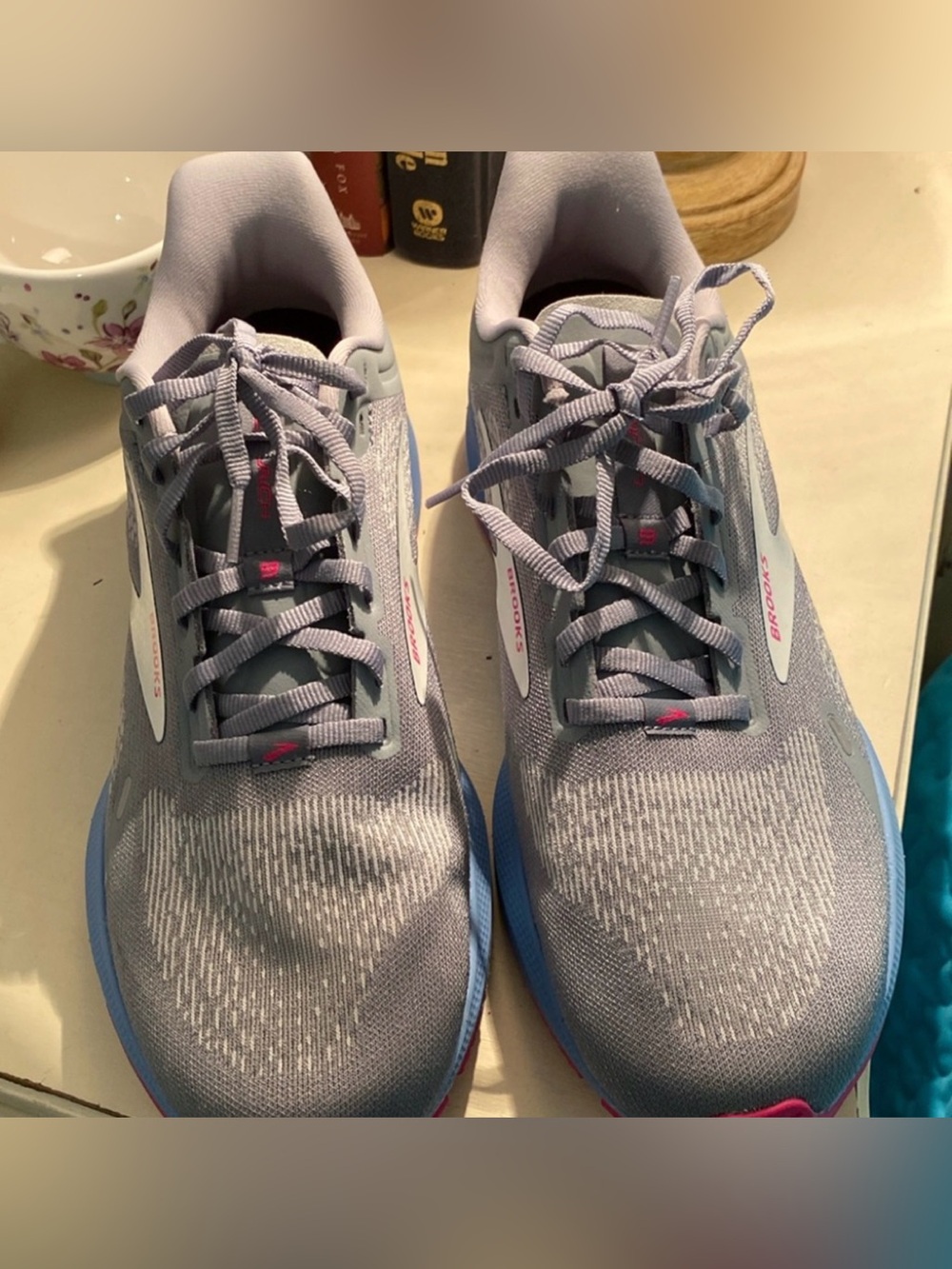 Brook’s tennis shoes almost new condition, worn once.  Gray and pink size 10